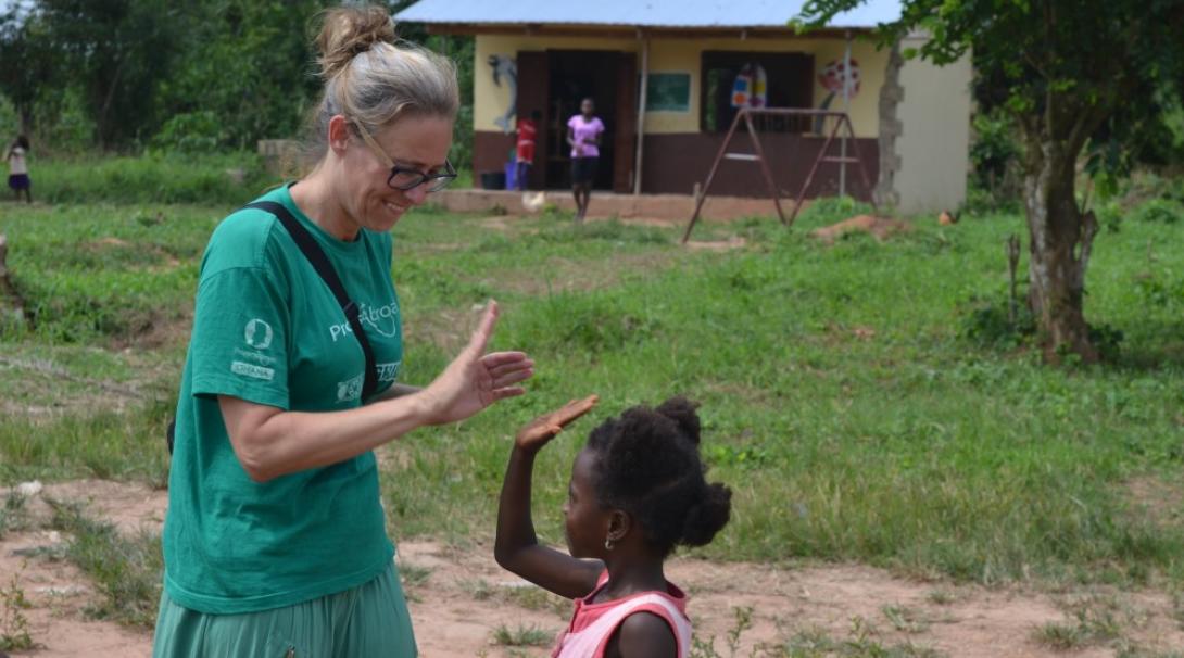 A woman plays with a child in Ghana A woman plays with a child in Ghana